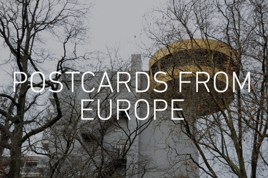 Graphic with an image of a building and trees in the background, with the words 'POSTCARDS FROM EUROPE' overlaid in white in the centre.