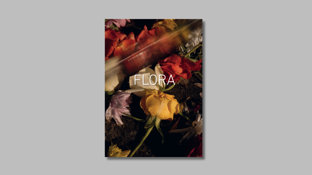 FLORA photobook cover with atmospheric image of roses shot through blurred surface.